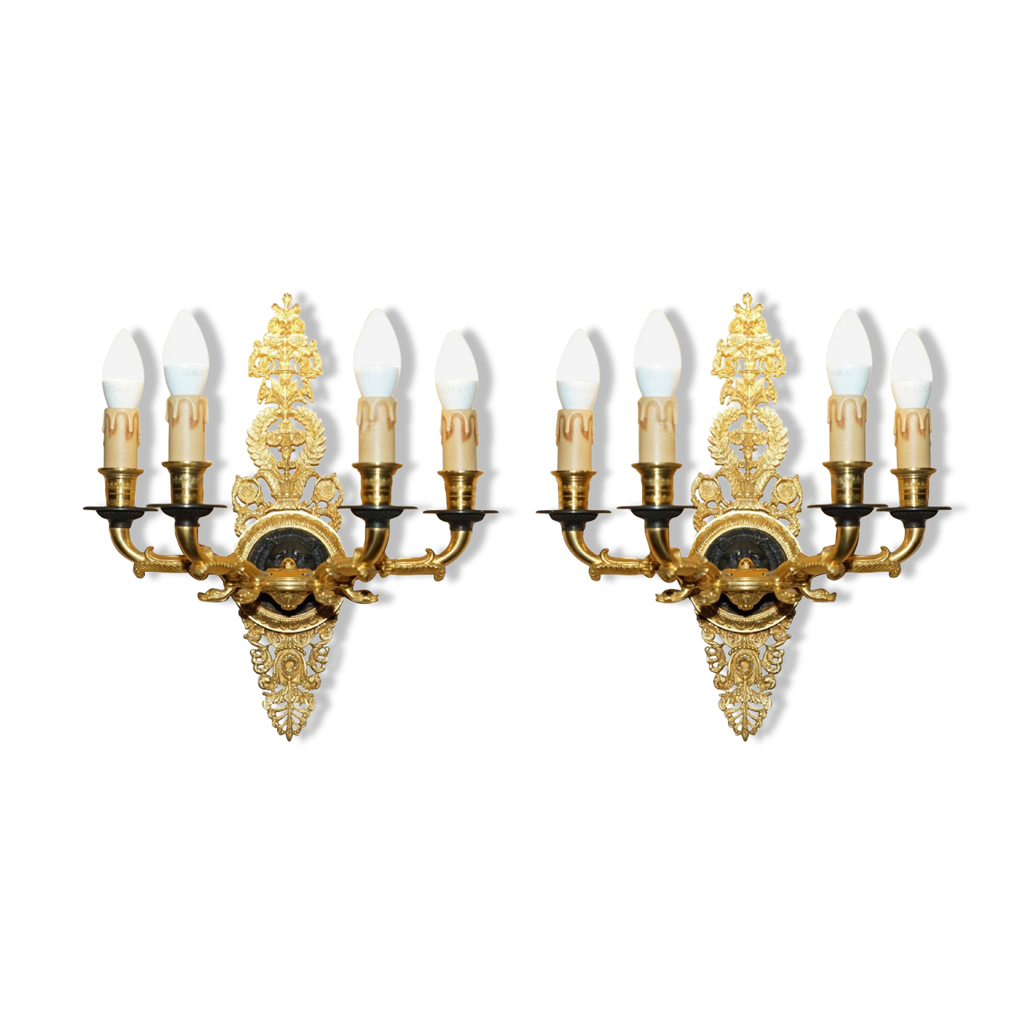 Pair of L'Originale wall sconces plated with 24-carat gold featuring four bronze candles.
