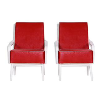 Red Leather mid Century Armchairs made in 1950s Czechia. Restored beech.