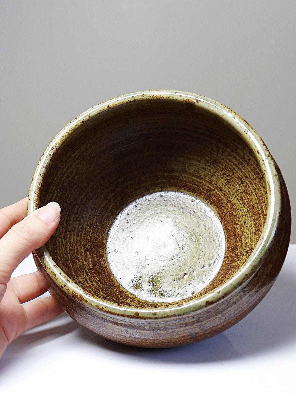 Vintage glazed stoneware bowl or planter in rustic wabi-sabi style.