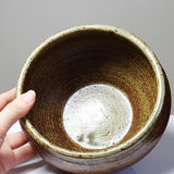 Vintage glazed stoneware bowl or planter in rustic wabi-sabi style.