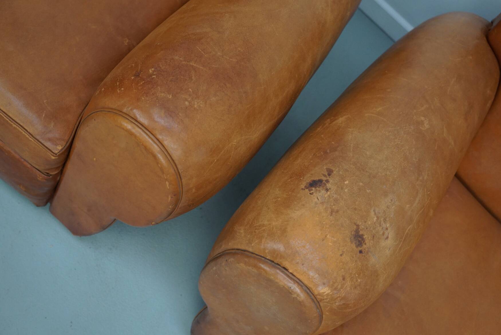 Pair of French club chairs with moustache back in cognac leather, 1950s