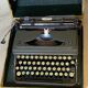 Triumph perfekt typewriter with its transport box.