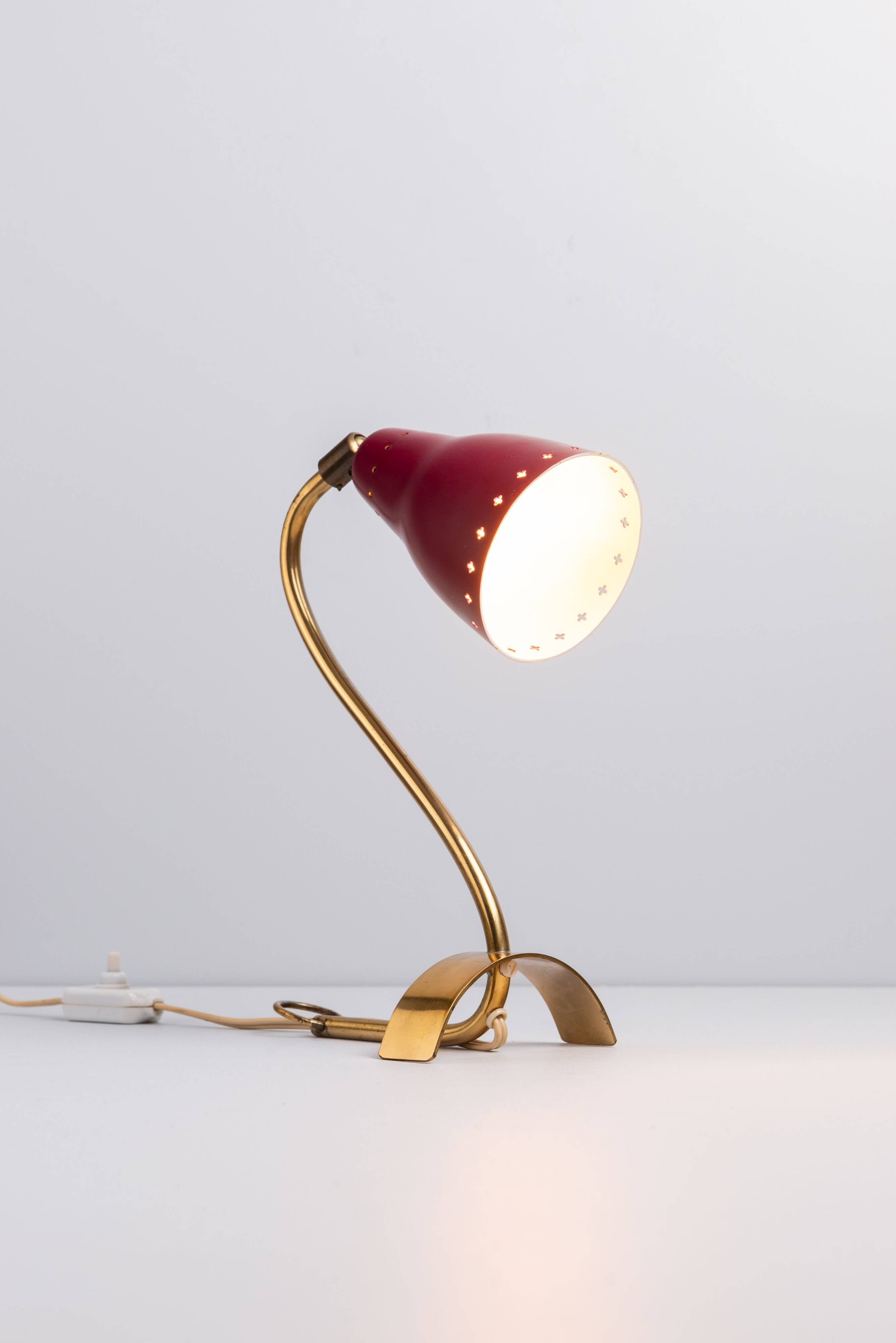 Brass wall lamp with perforated metal shade, 1950s, Sweden