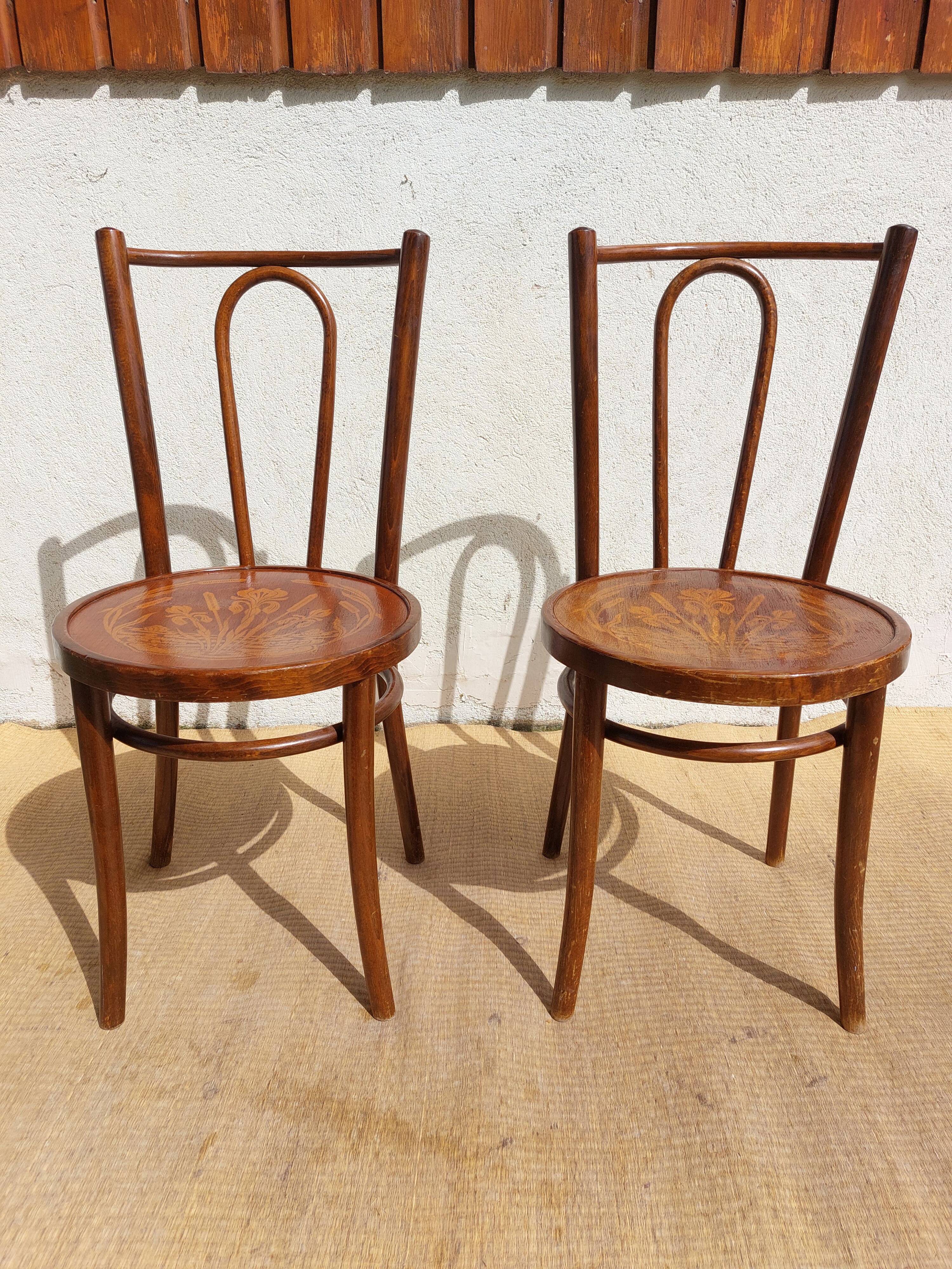 pair of bistro chairs, curved wood and pattern on the seat