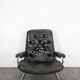 Stressless armchair and ottoman in leather from the 1970s.