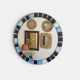 Round mosaic mirror in the style of Vallauris, France circa 1970.