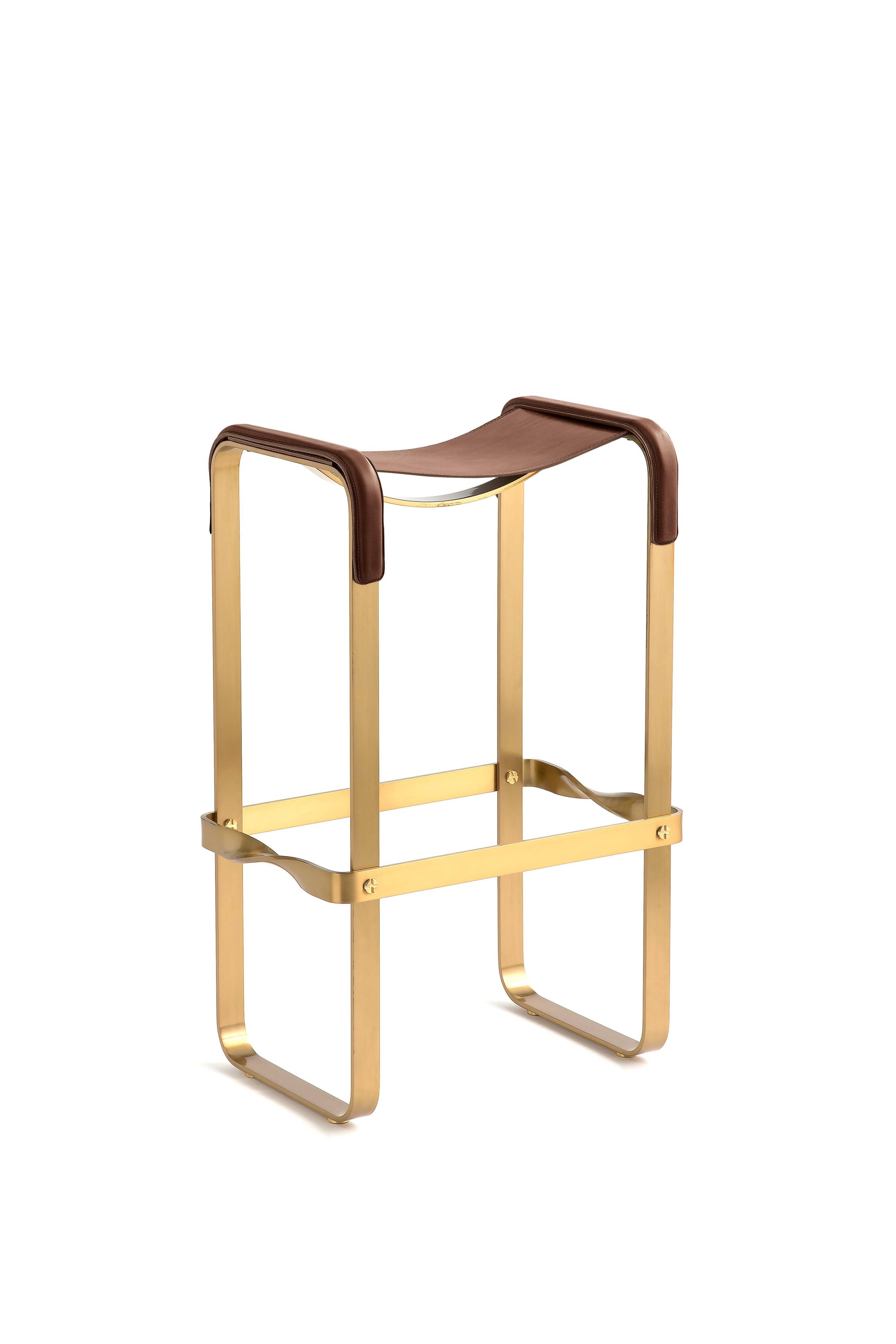 Contemporary kitchen stool, aged brass metal and cognac leather.