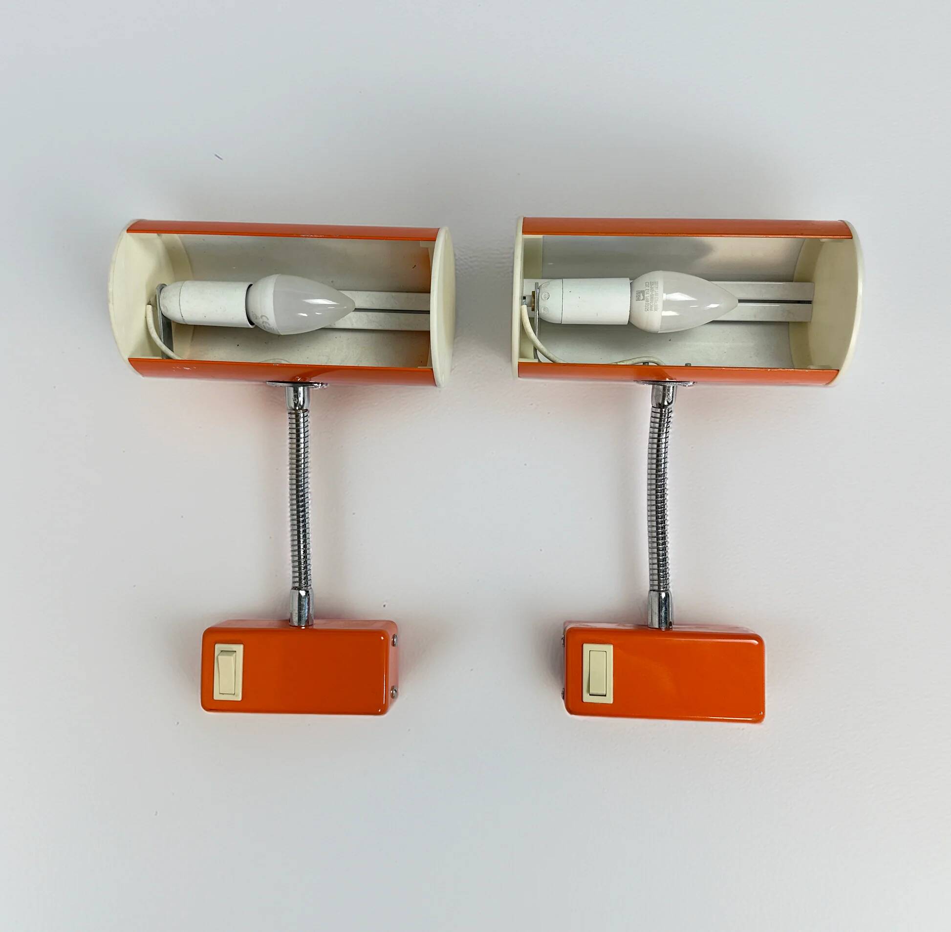 Pair of orange wall sconces from the 1970s by Ateljé Lyktan.
