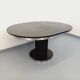 Vintage dining table in melamine with a black wood effect and chrome metal.