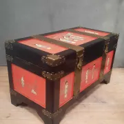 Red lacquered wooden mallet from the Far East.