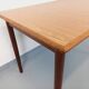 Rectangular dining table in vintage Scandinavian style made of teak and melamine.