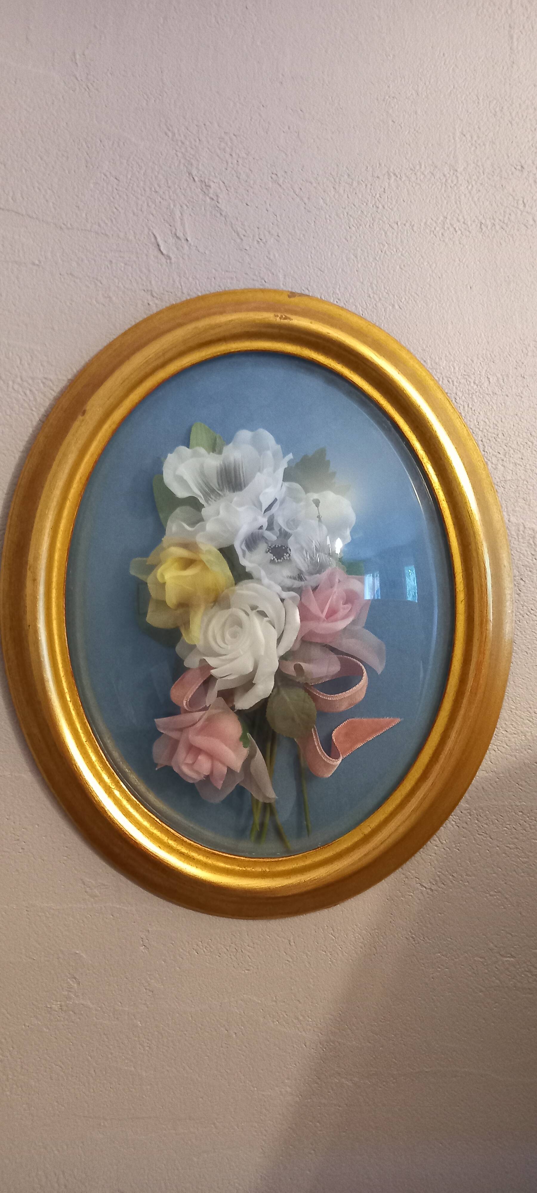 Silk flower frame under curved glass