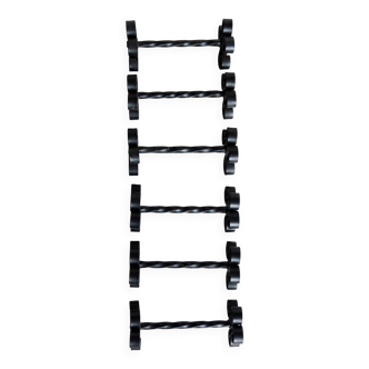 6 vintage black metal knife rests with scrollwork decoration