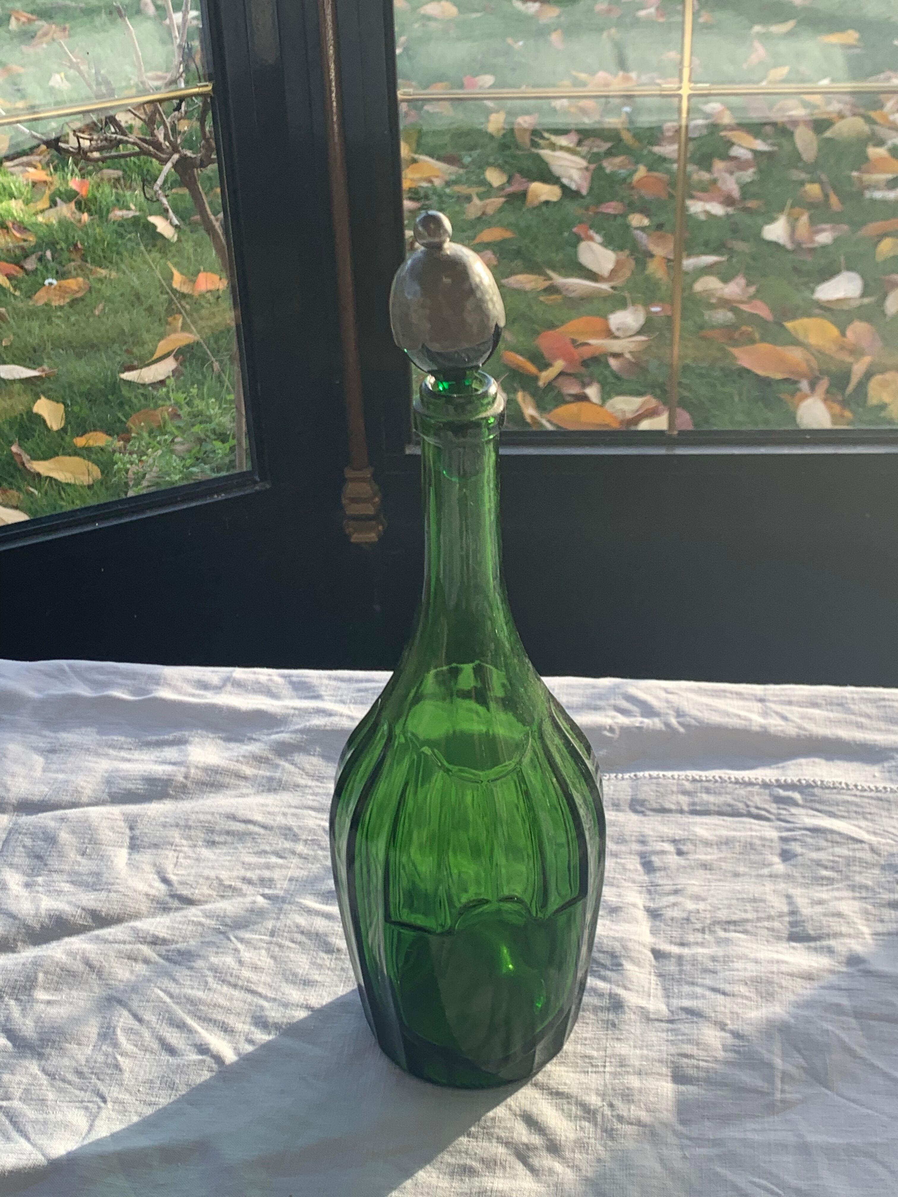 Bottle, green glass bottle green stopper and antique pewter