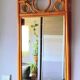 Curved wooden mirror and rattan