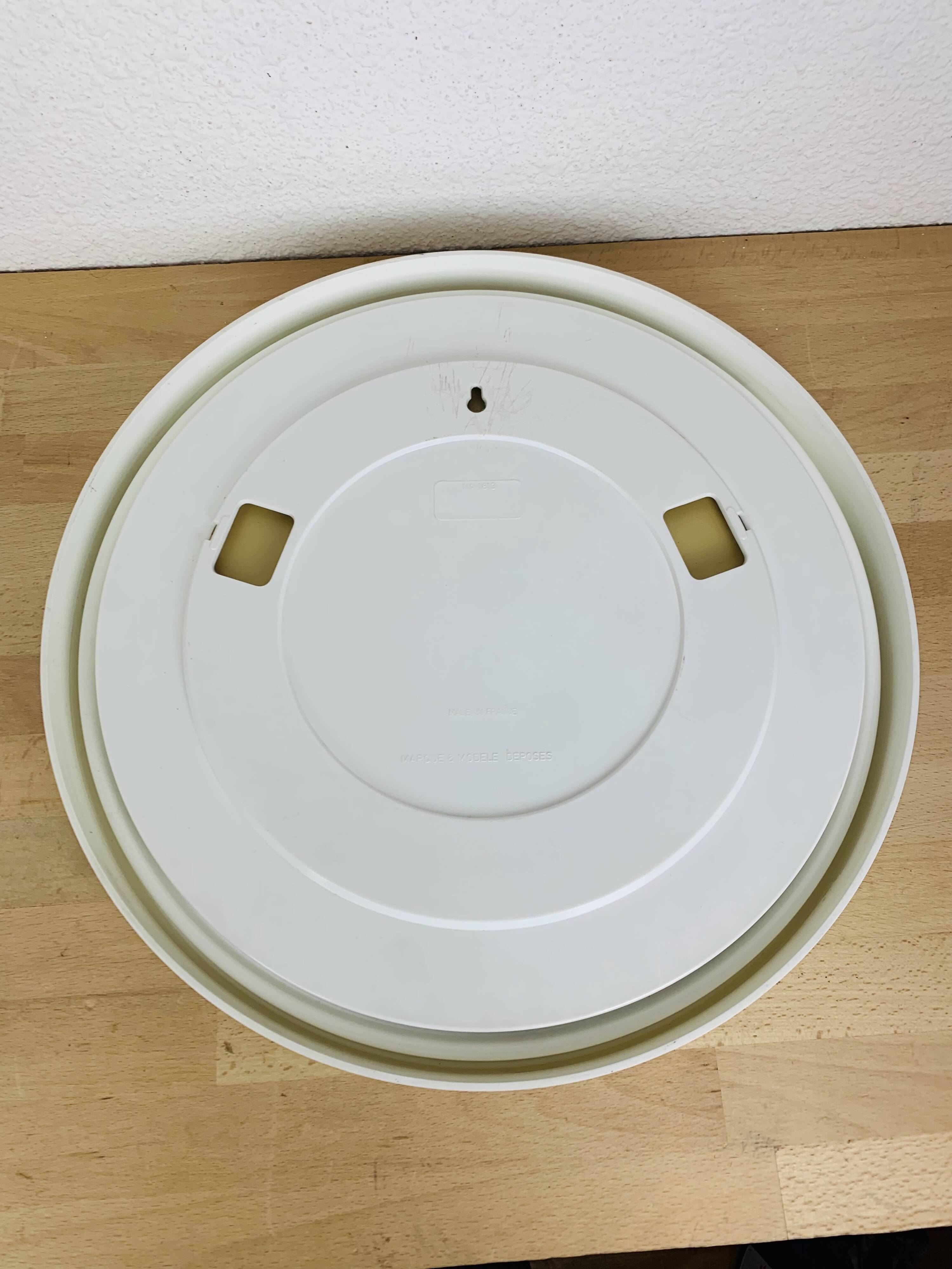 Space age mirror with white frame from the 1970s.