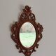 Classic red and gold patinated rocaille mirror, 35 cm x 23 cm