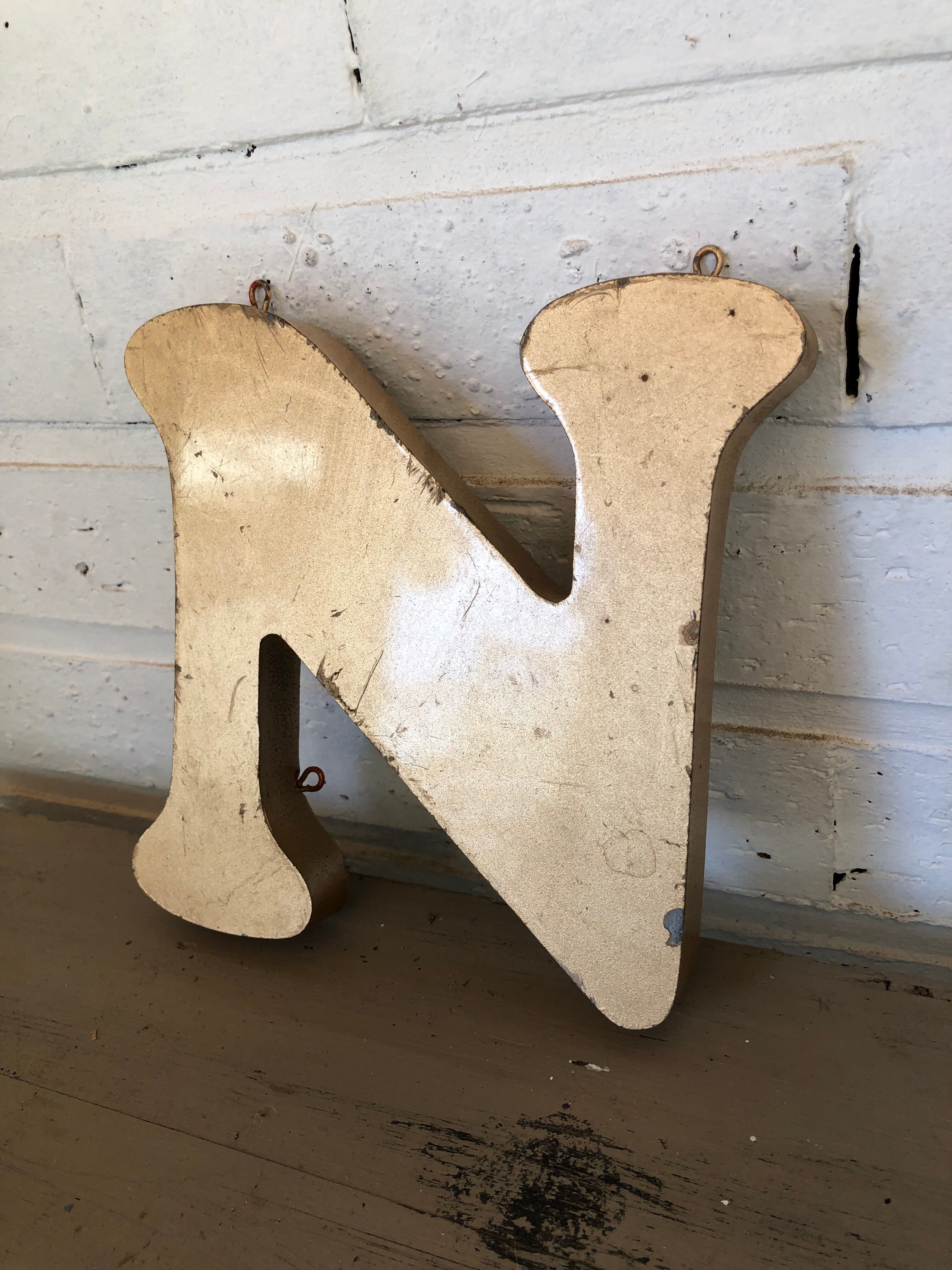 Golden sign letter "N"