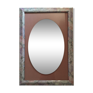 Miroir ovale sur cadre rectangulaire