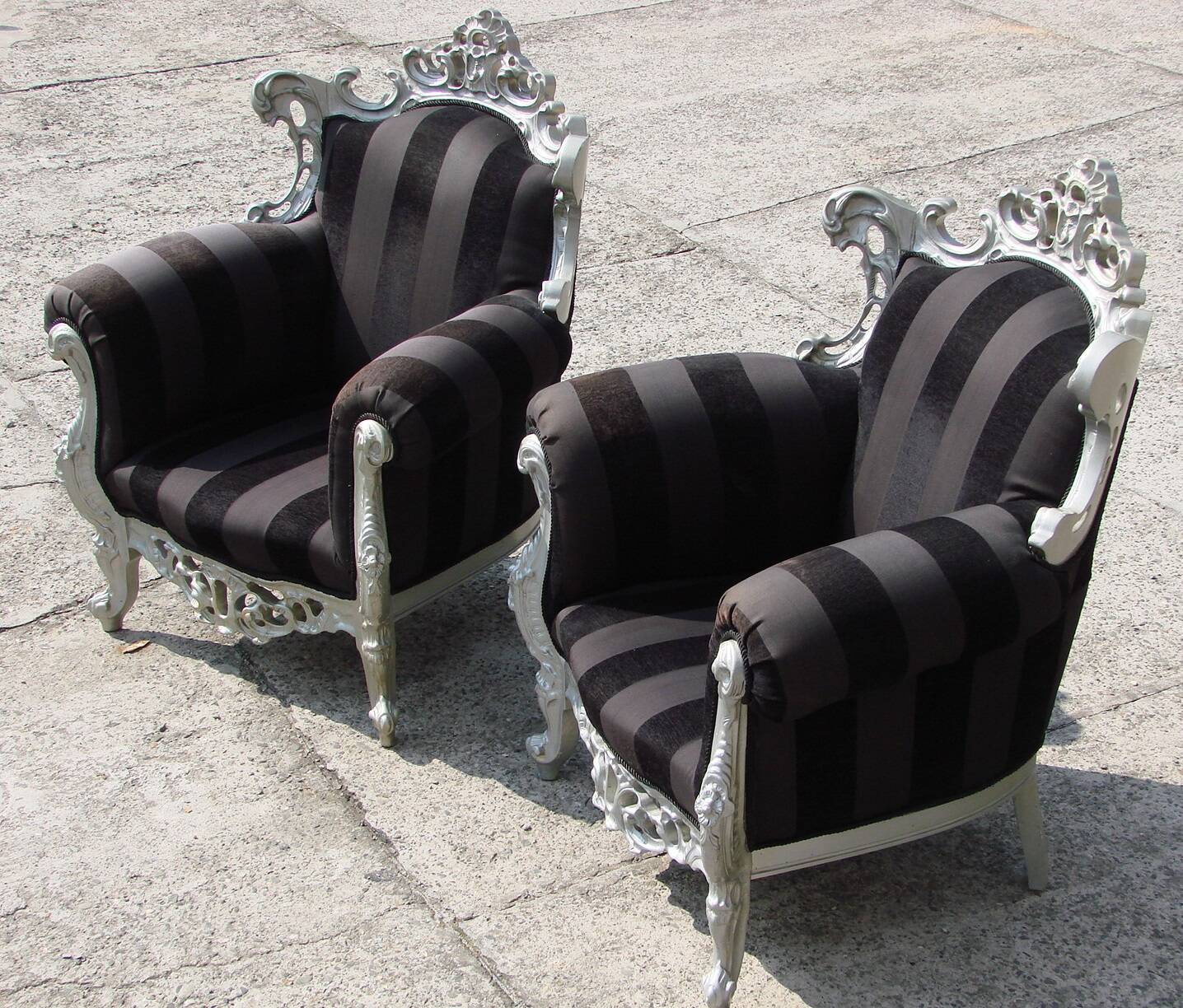 A pair of vintage armchairs, 1980s, lacquered wood and fabric