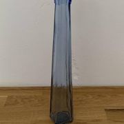 Translucent blue glass vase from the 1980s — tall prismatic silhouette, polygonal base.