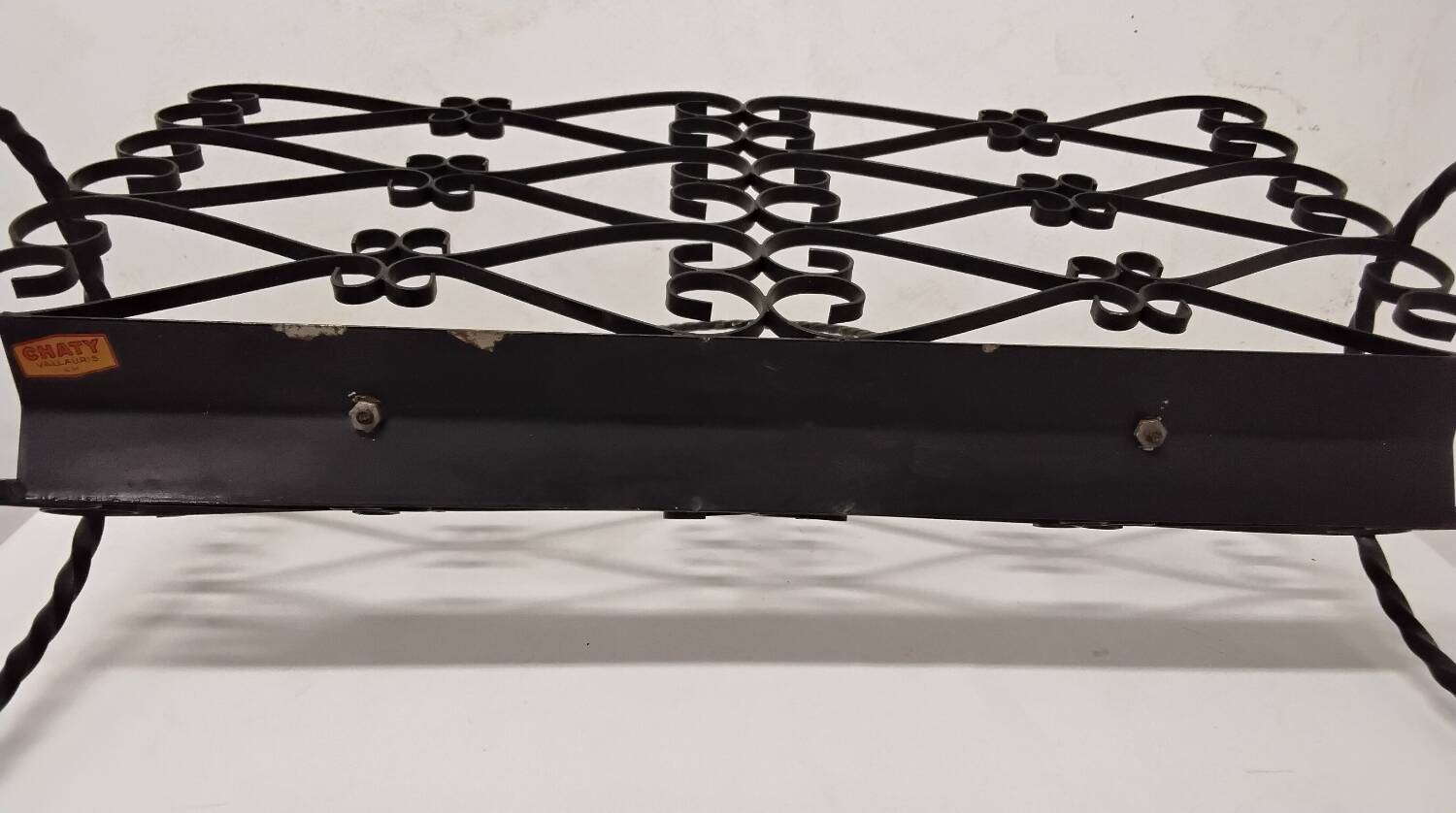Wrought iron magazine rack signed CHATY Vallauris