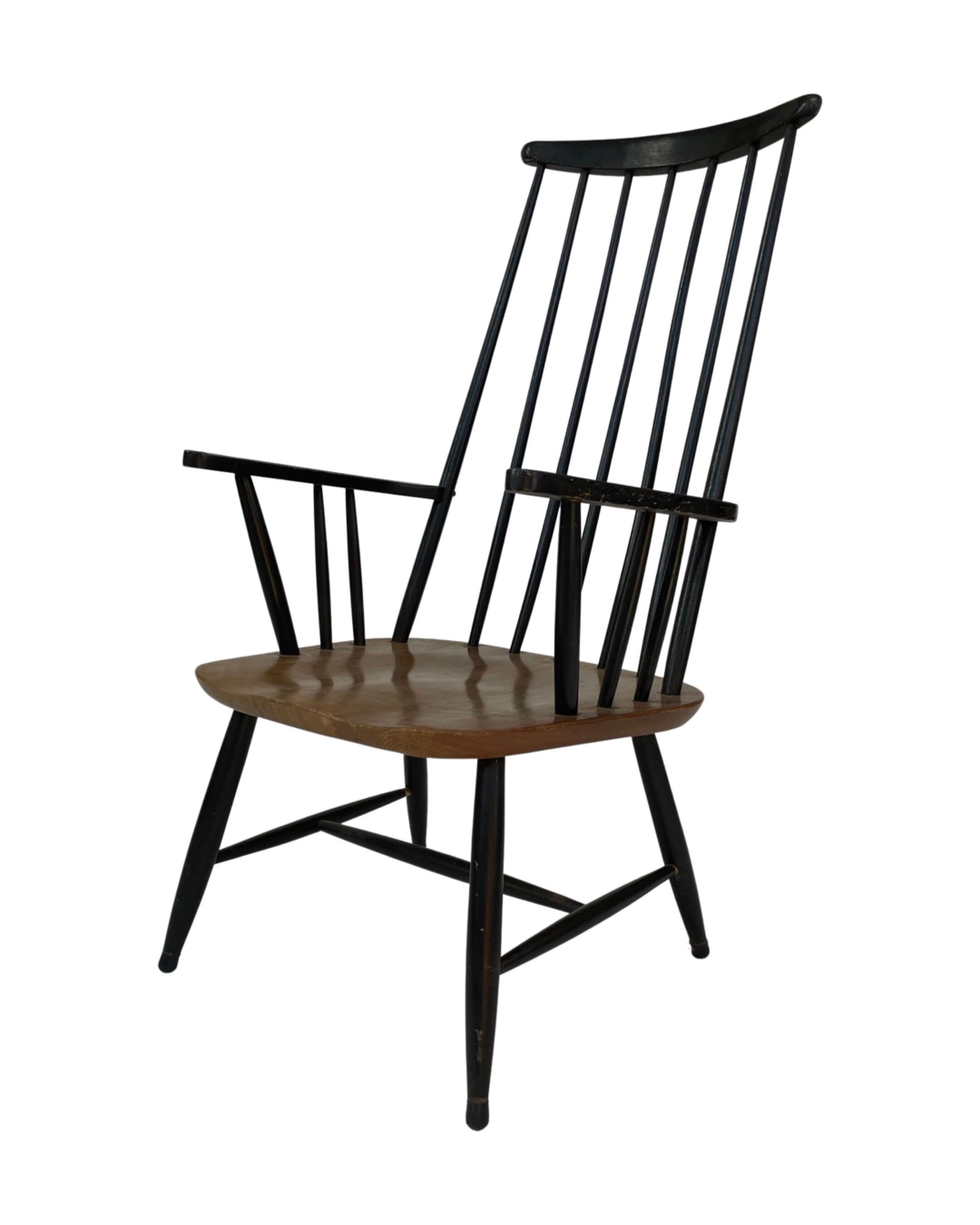Vintage easy chair with high back and armrest from the 60s