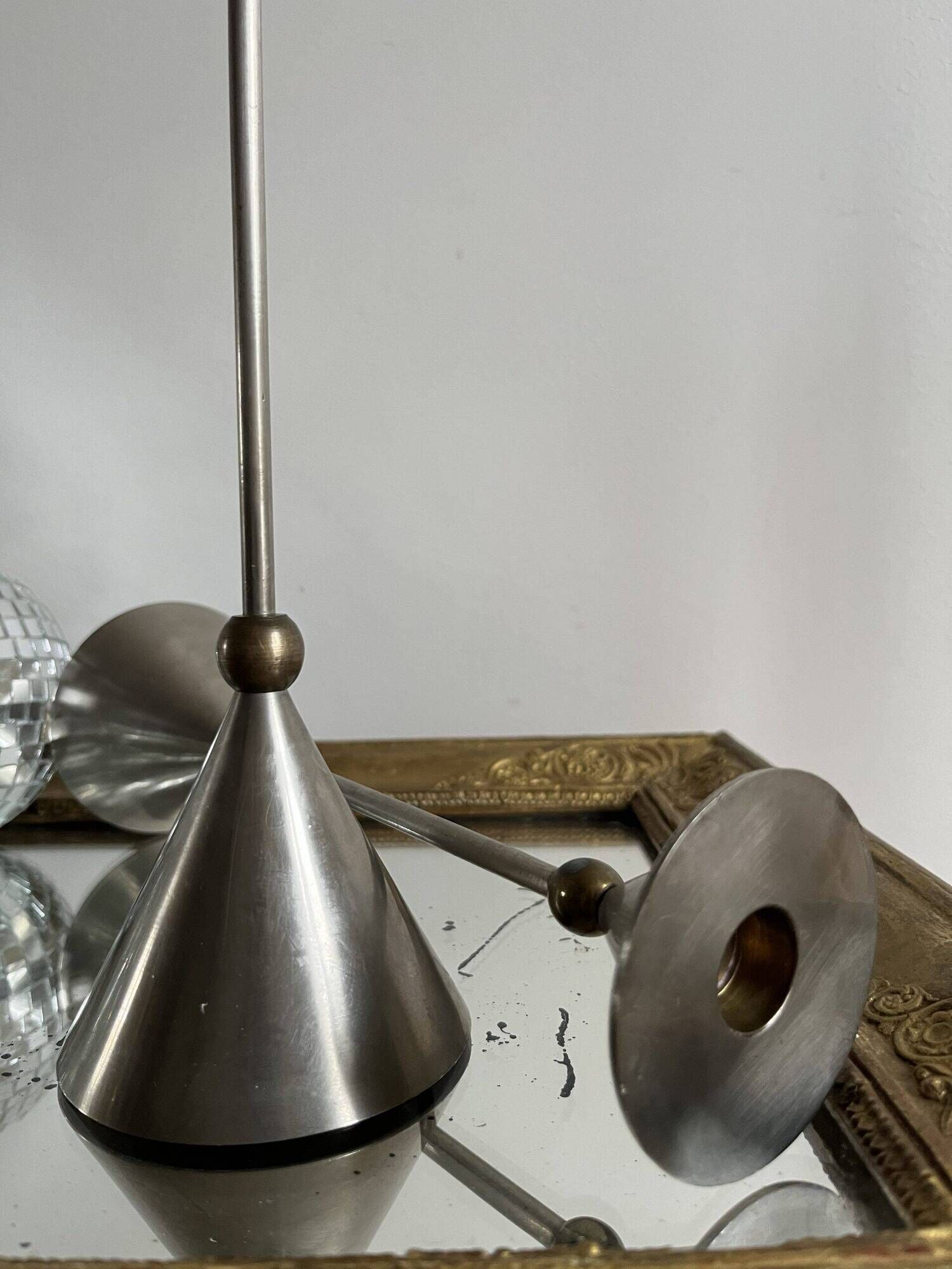 Pair of high vintage metal and brass candlesticks