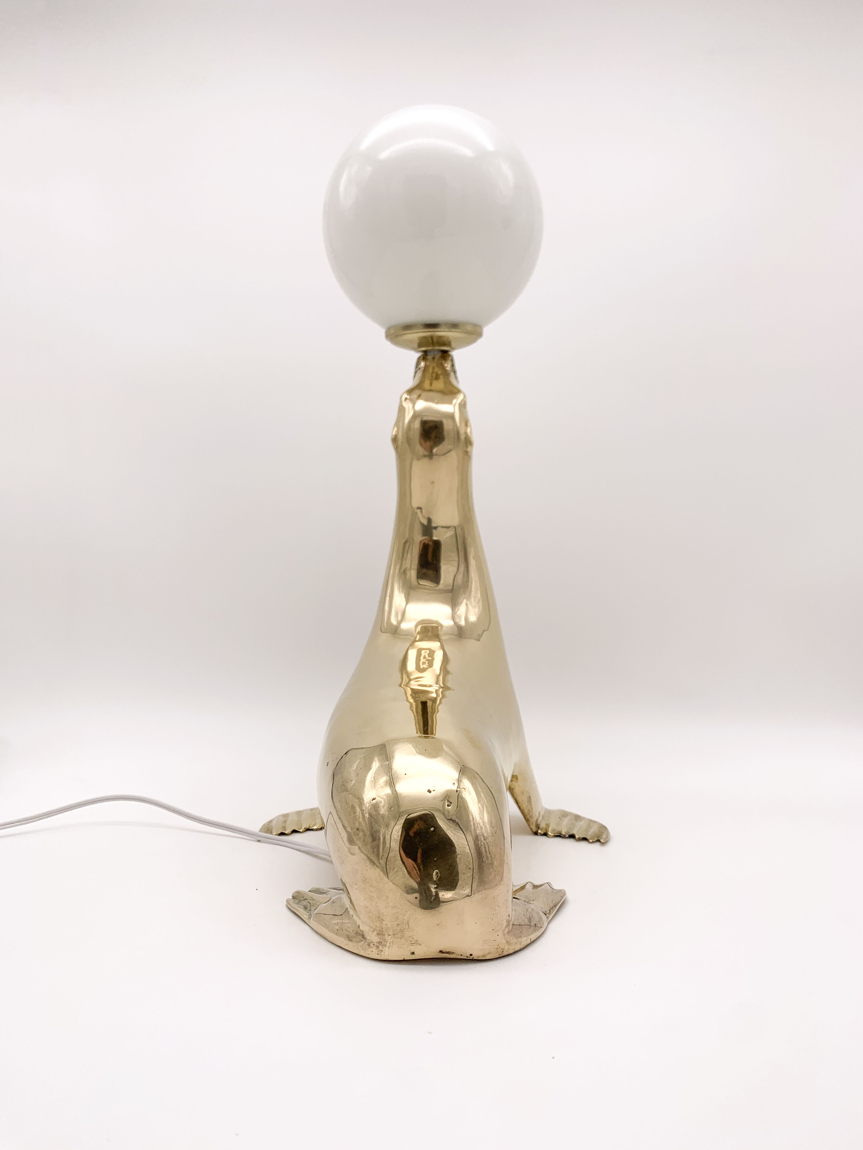 Vintage brass sea lion lamp