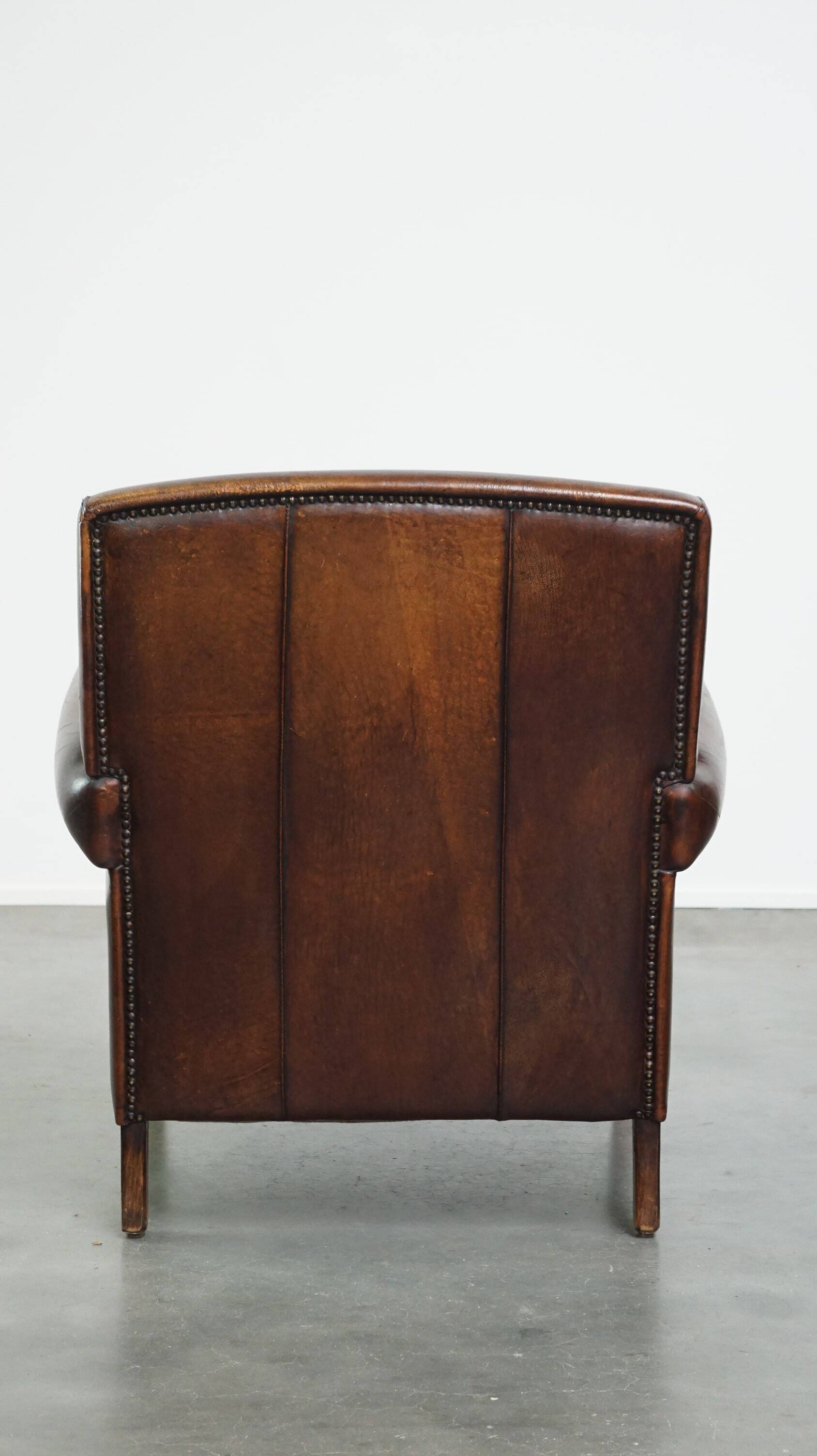Vintage sheepskin armchair with beautiful warm colors and excellent seating comfort