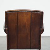 Vintage sheepskin armchair with beautiful warm colors and excellent seating comfort