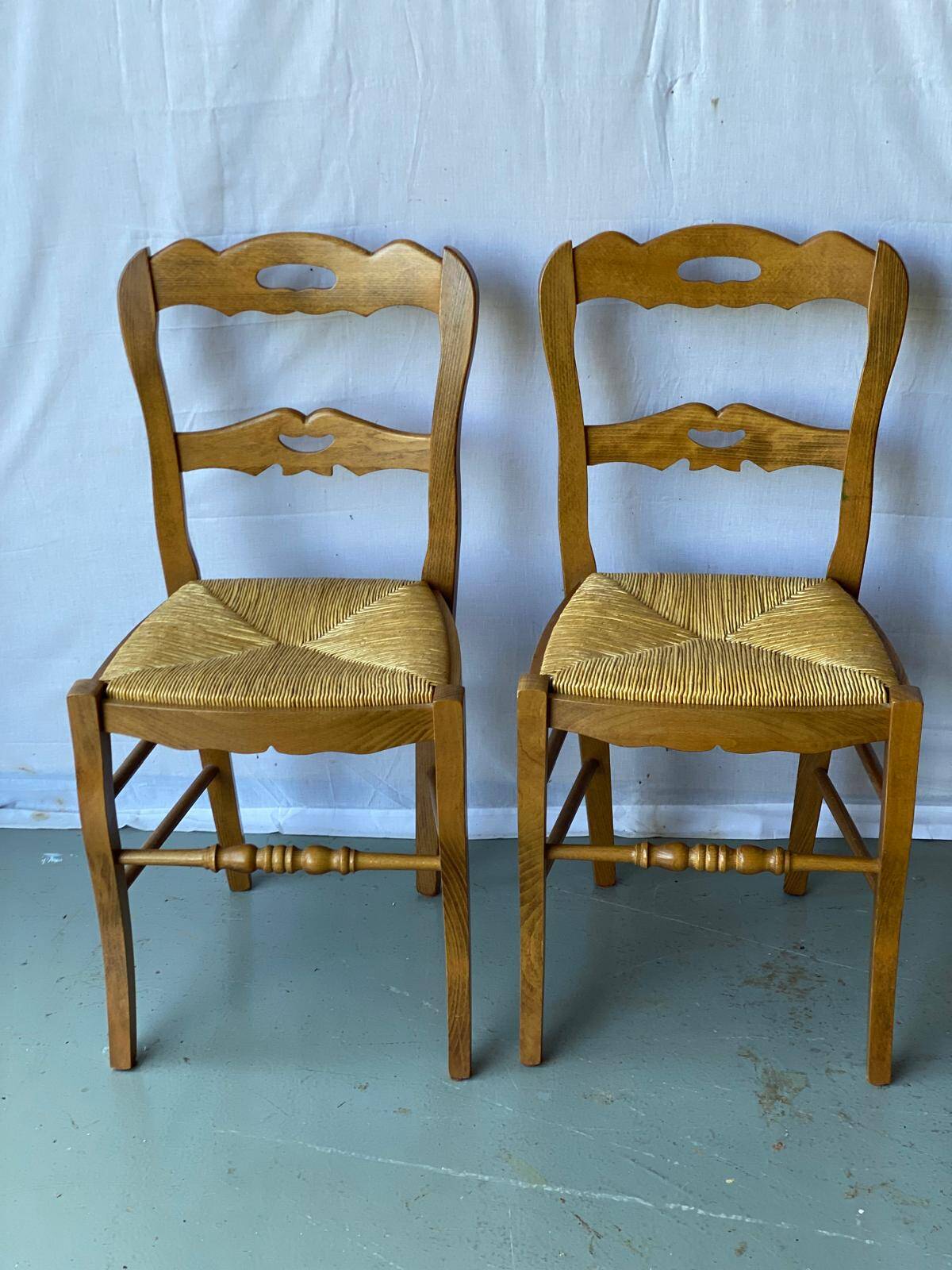2 solid wood and straw dining chairs