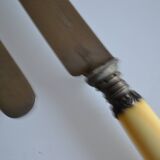 11 antique dessert knives from the 19th century with ivory-colored handles and a monogram