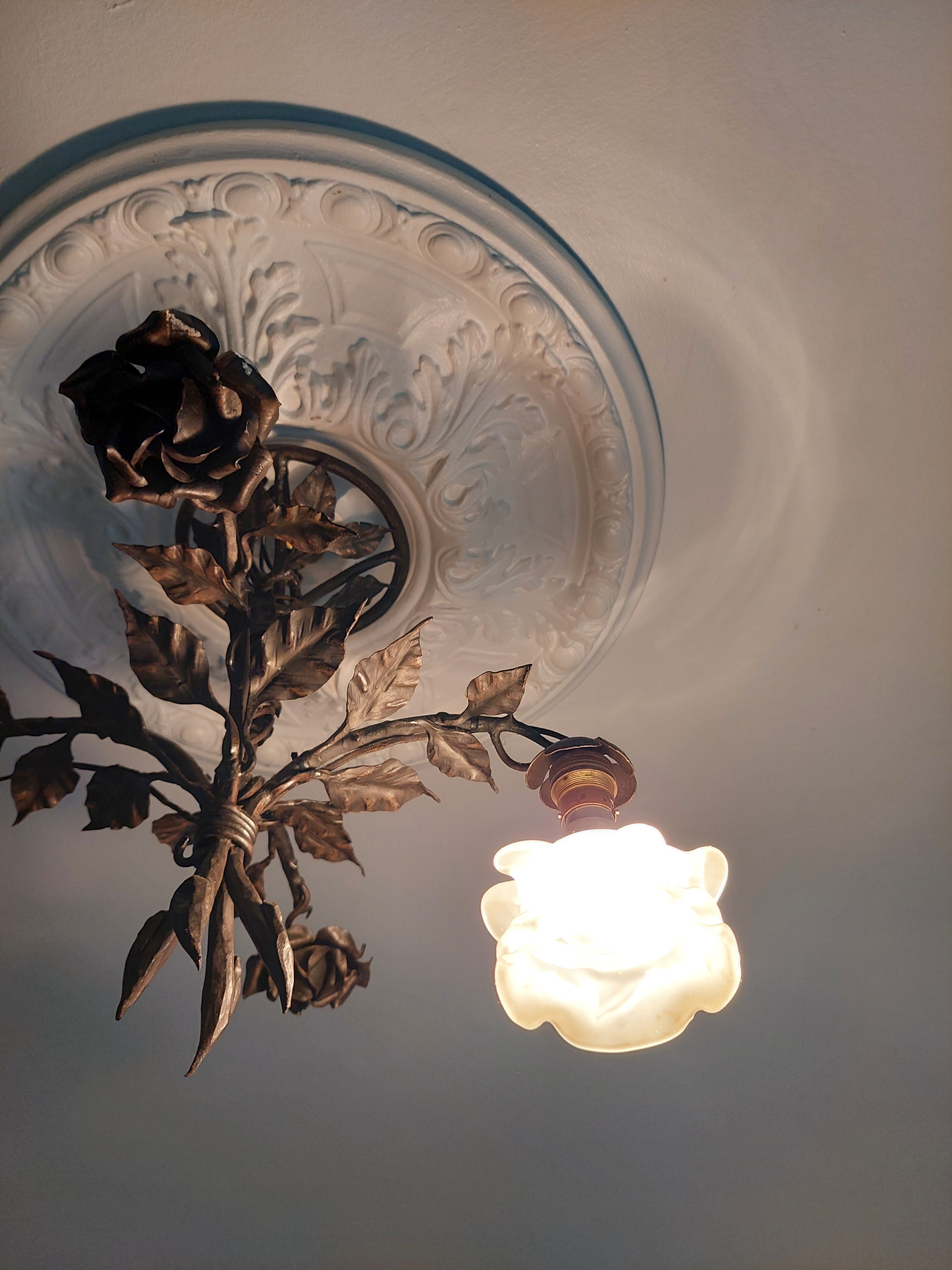 Chandelier with wrought iron and glass rose patterns