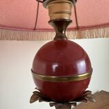 Art deco style desk lamp with a burgundy red sphere in the center the body is in lacquered iron