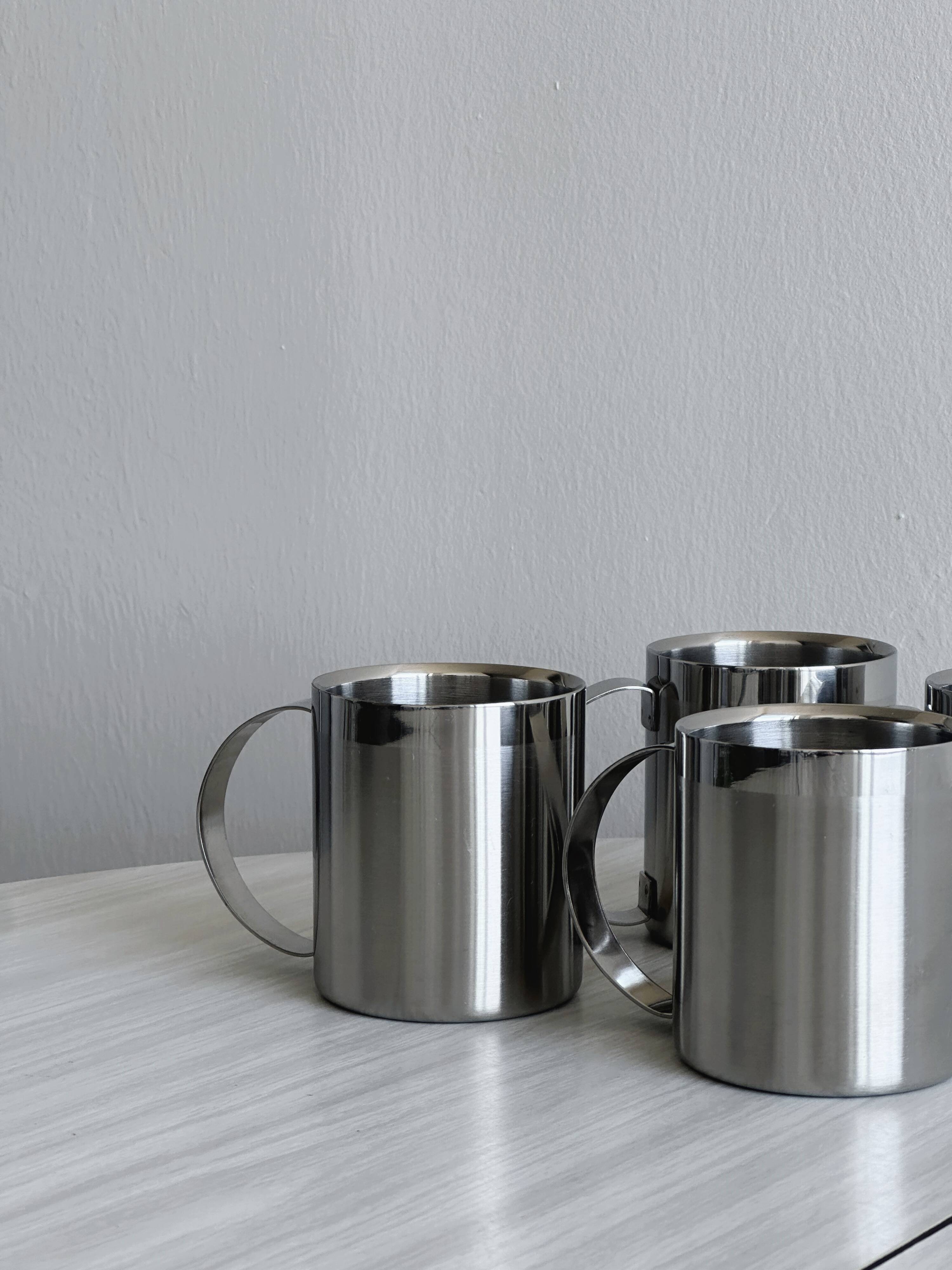 Set of 4 shiny stainless steel mugs