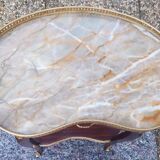 Louis XVI period pedestal table, in solid mahogany and veneer, and in gilded bronze.