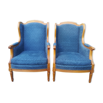 Paire de fauteuils à oreilles style Louis XVI