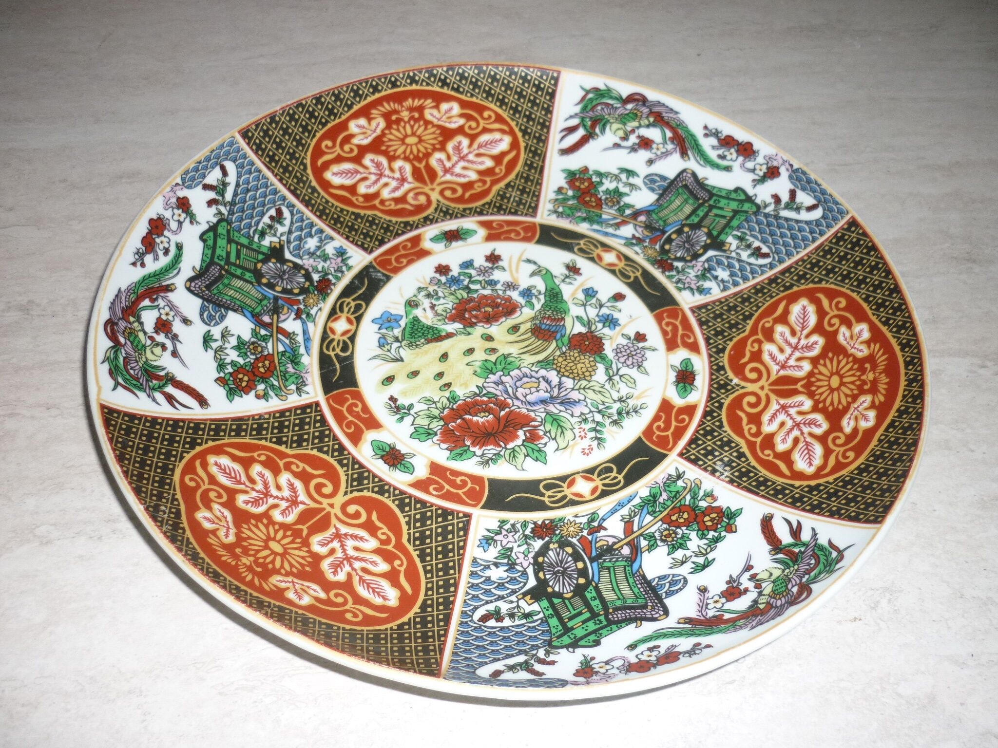Chinese dish decorated with peacocks and plants