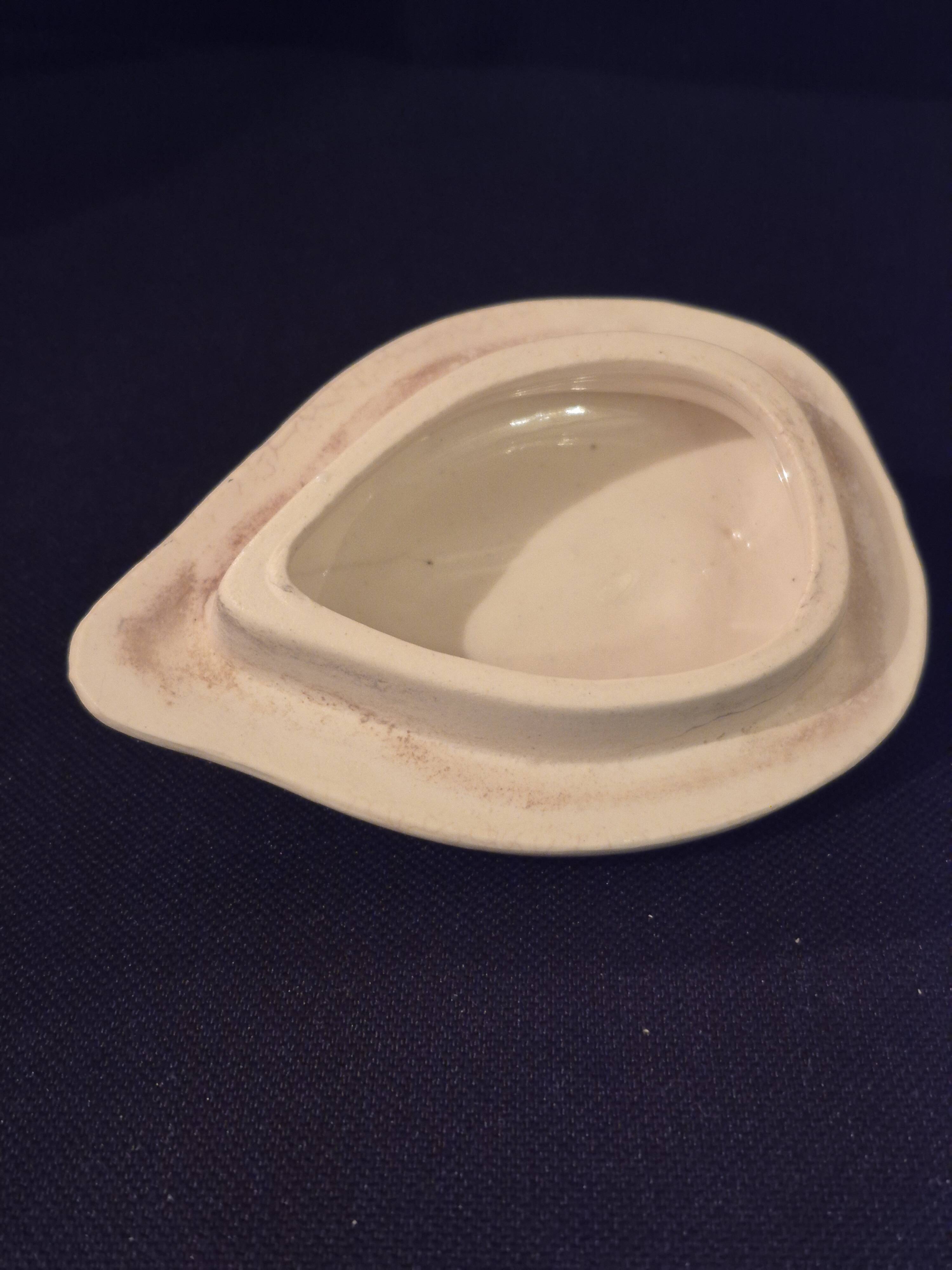 Old covered jug, vintage, geometric frieze and flowers with a border.