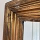 Antique giltwood wall mirror in gold