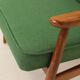 Scandinavian modern chair in green wool, vintage wooden armchair.