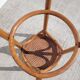 Old low caned bistro stool