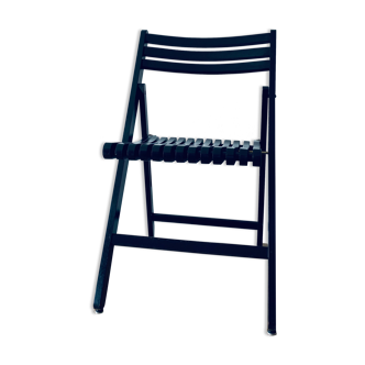 Chaise pliante noire en bois et laiton