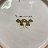 Pair of Nevers earthenware plates signed Georges