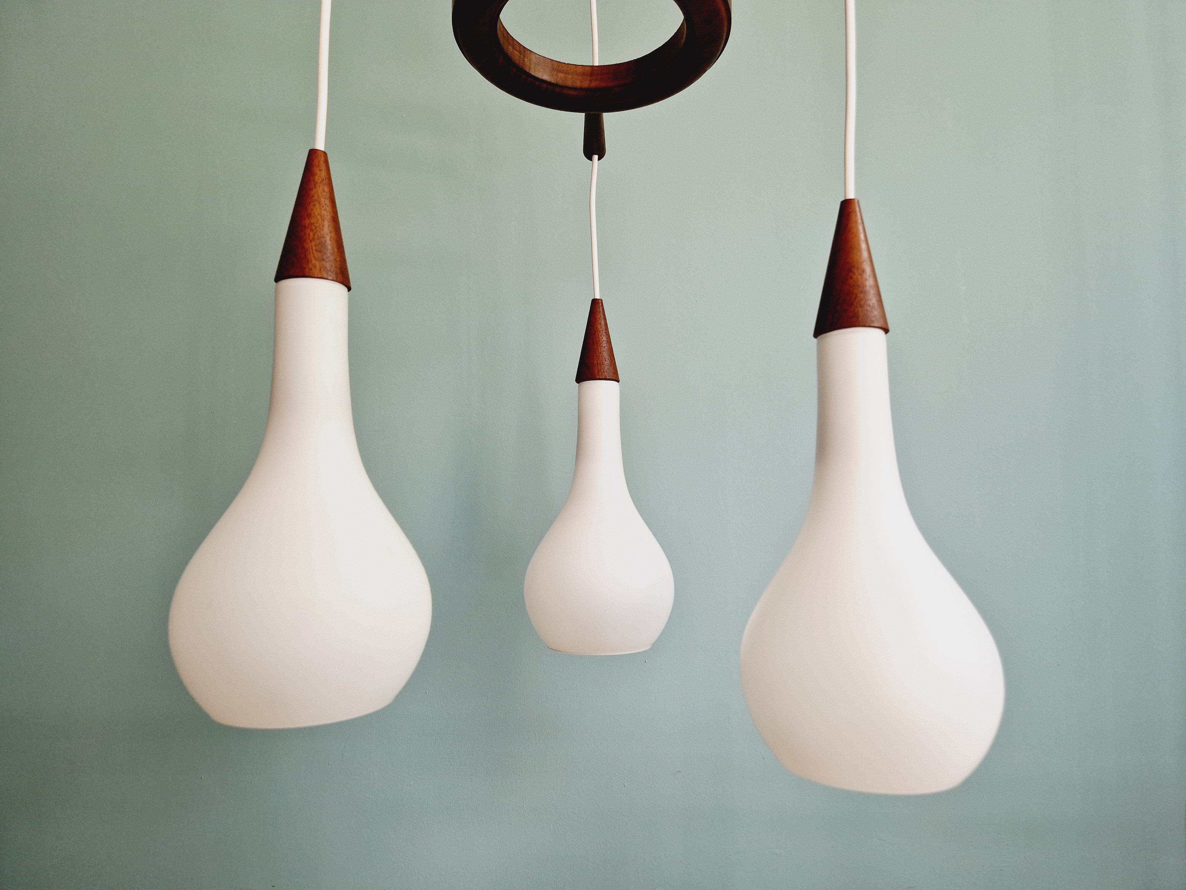 Scandinavian teak and frosted white glass chandelier, 1960.