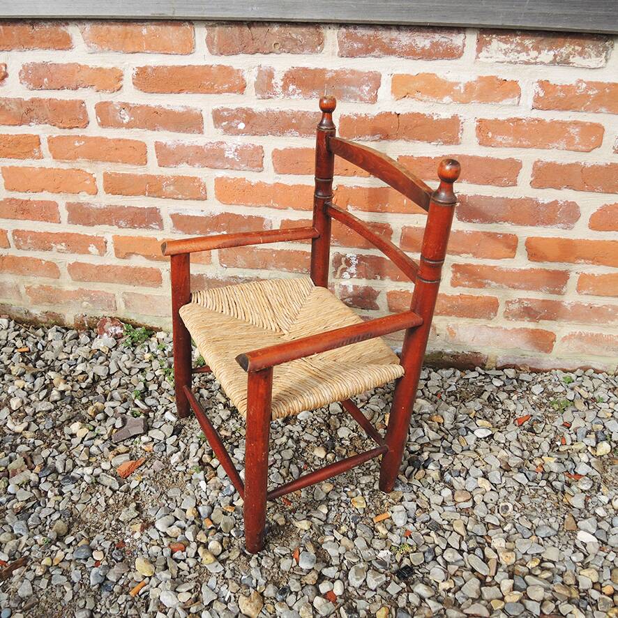 Old straw armchair for children