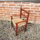 Old straw armchair for children