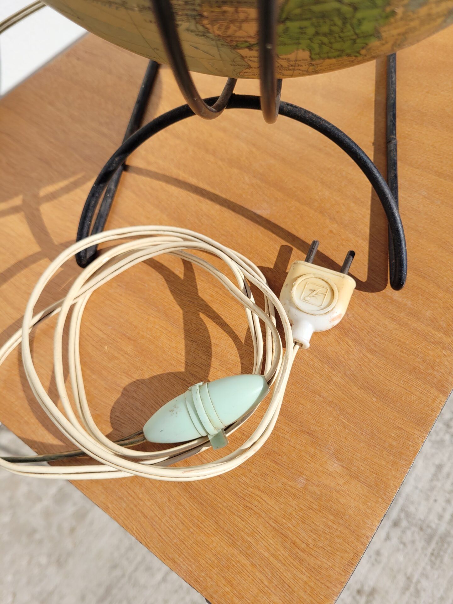 Old illuminated globe world map made of glass and paper.