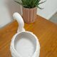 vintage porcelain flower pot in the shape of a swan